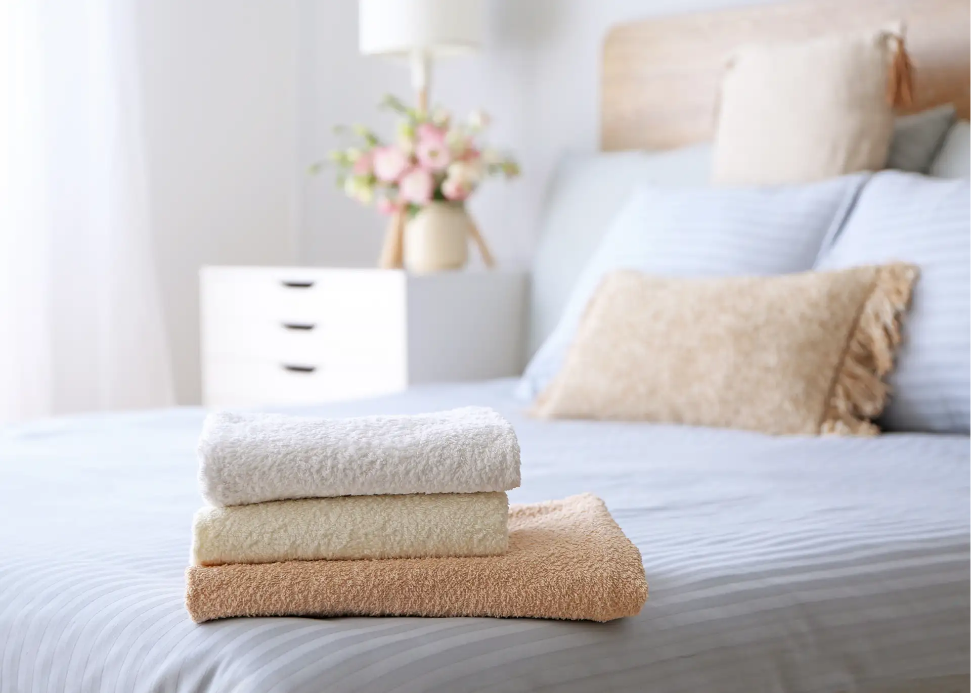 folded towels on the bed