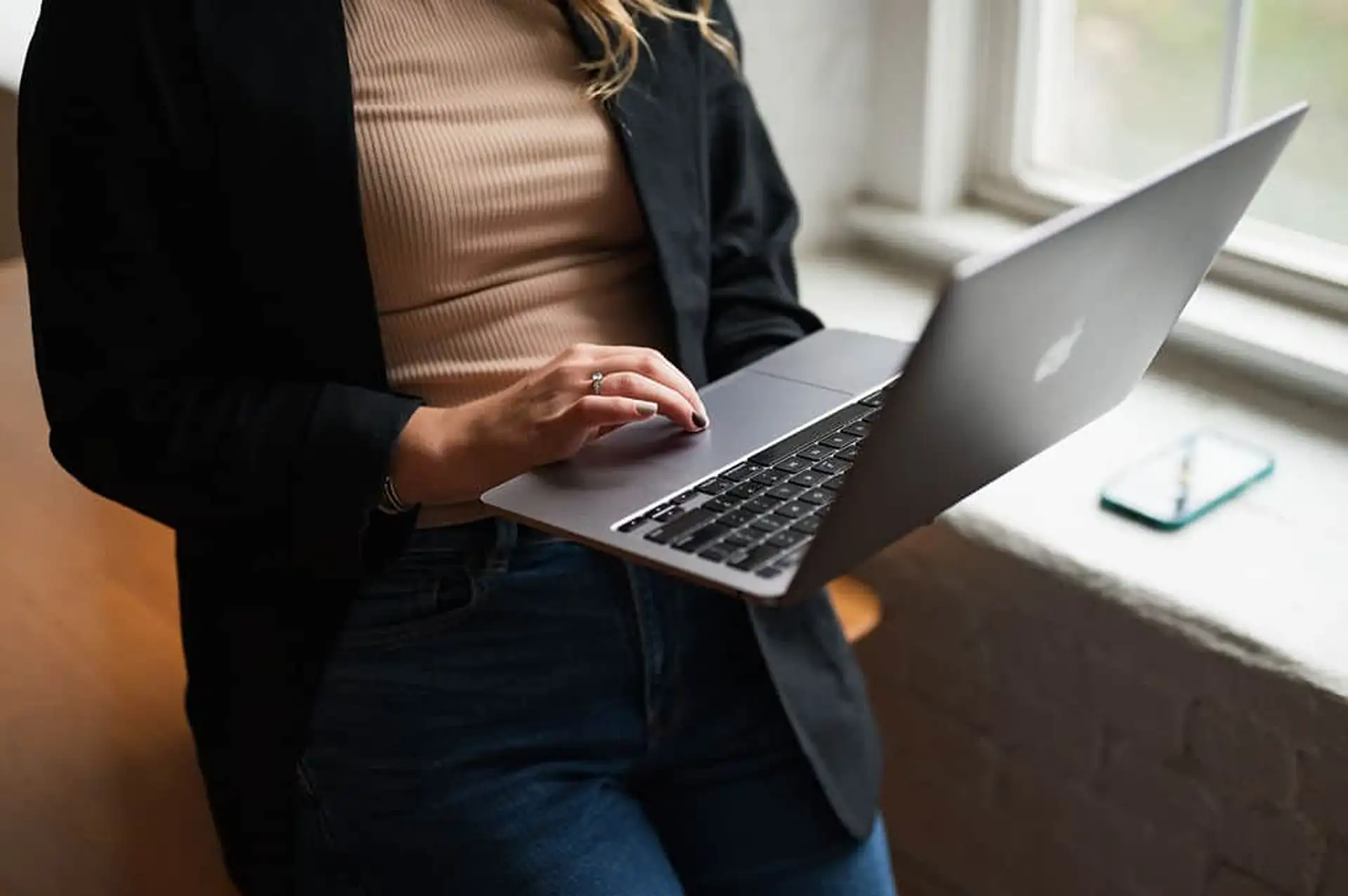 girl holding a laptop in her hands