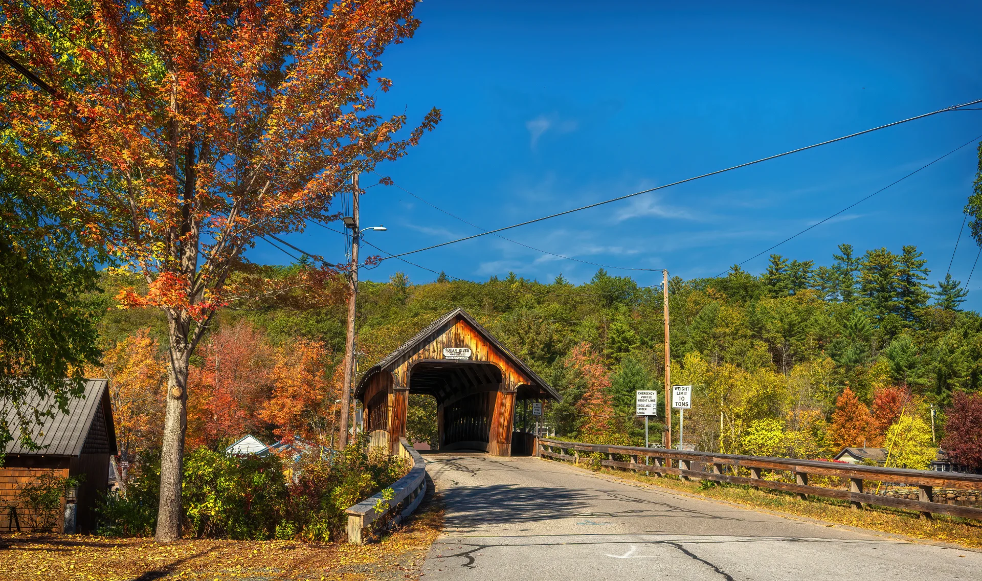 New Hampshire covered bridge surrounded by autumn foliage
