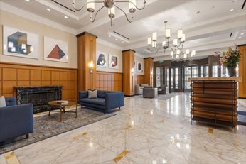 Clarendon lobby lounge with fireplace and armchairs
