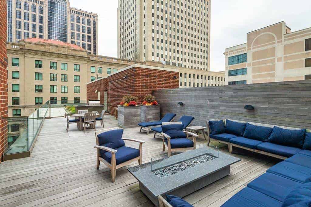 Roof deck with fire pit, lounge seating and grilling area