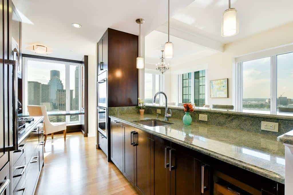 Kitchen with granite counters, wood cabinetry and Back Bay views