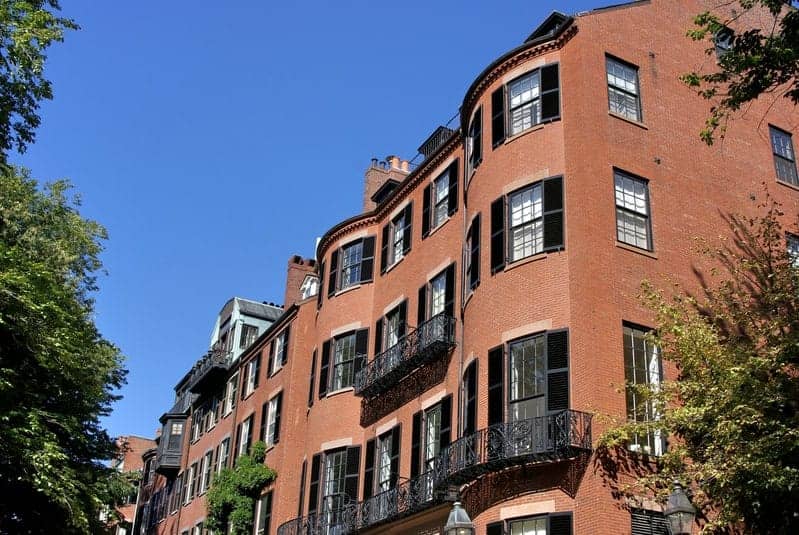 Brick bow-front row houses with wrought-iron balconies on Beacon Street