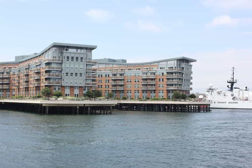 Battery Wharf seen from the harbour with a Coast Guard cutter alongside