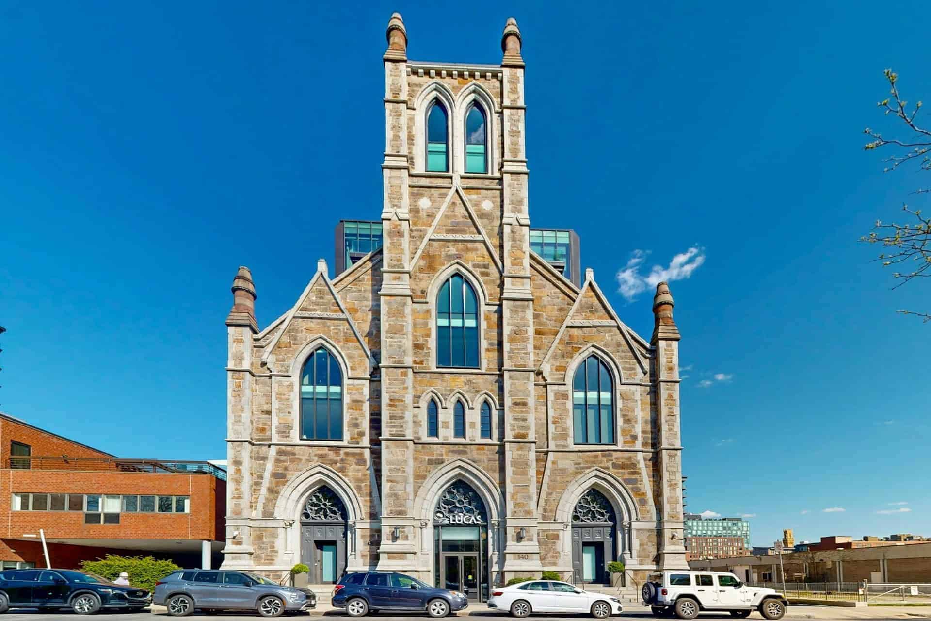 The restored Gothic stone facade of The Lucas on Shawmut Avenue