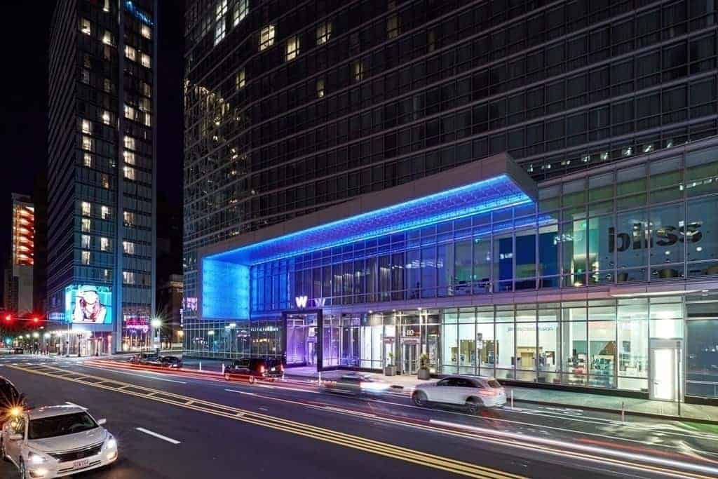 The W Boston entrance lit blue at night