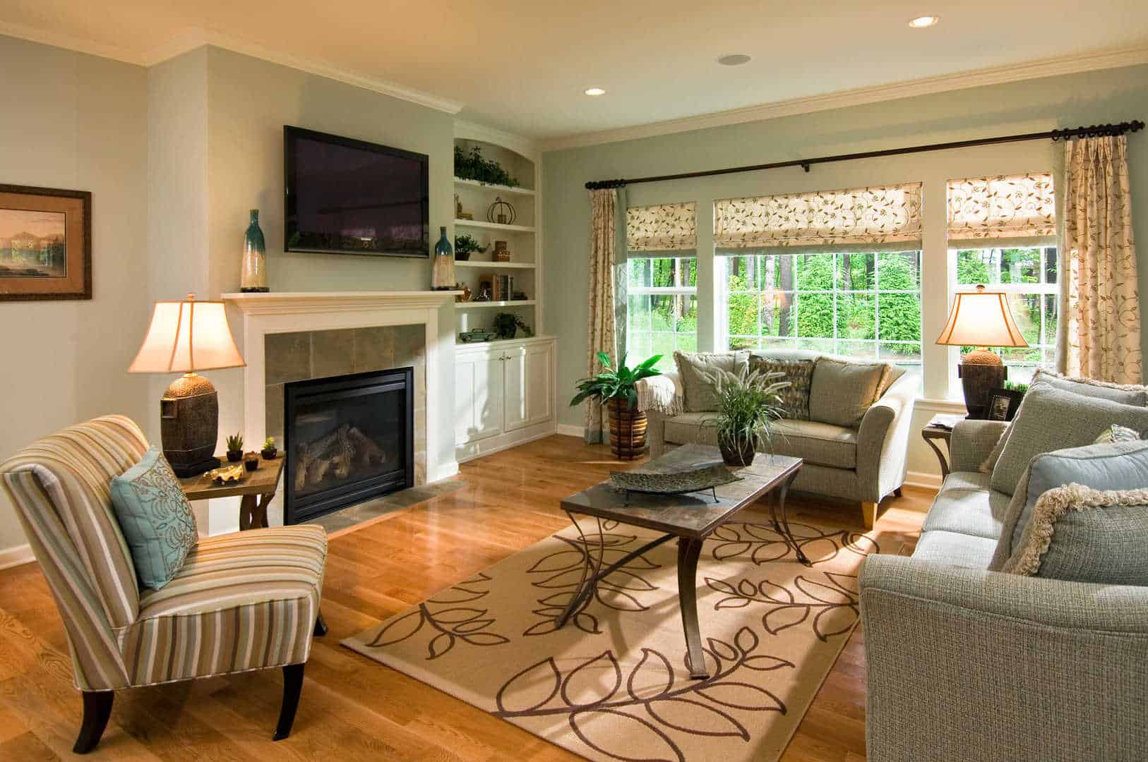 Great Room with Hardwood, Furniture, Built-Ins and a Gas Fireplace with Tile Surround