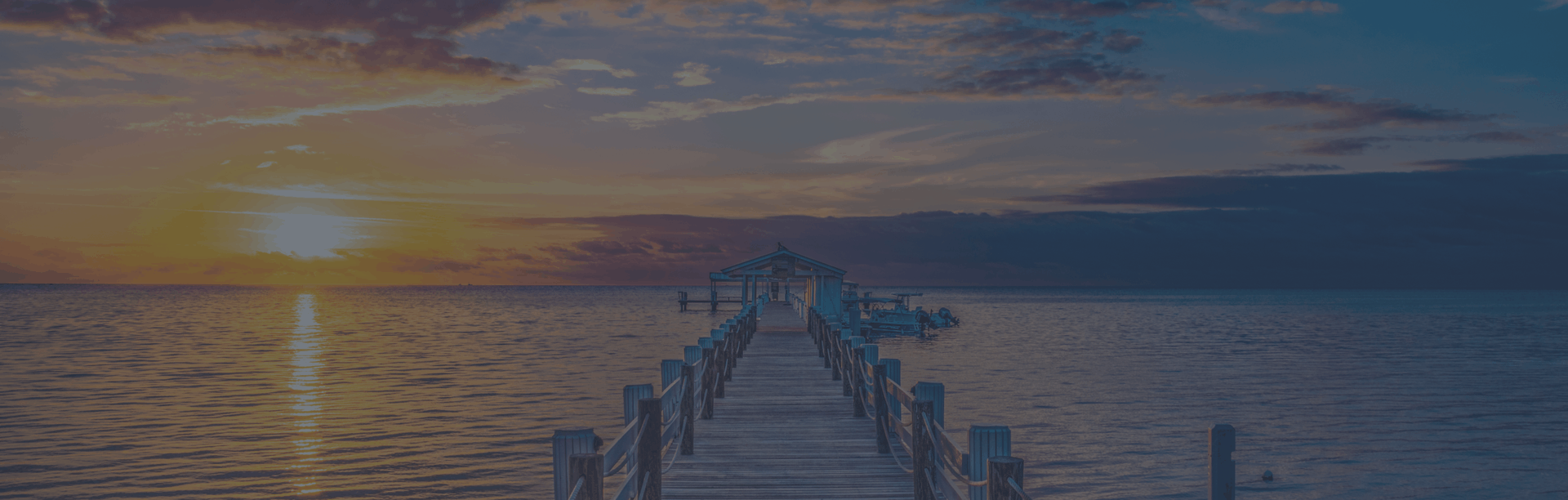 dock stretching out towards the sunset in the florida keys