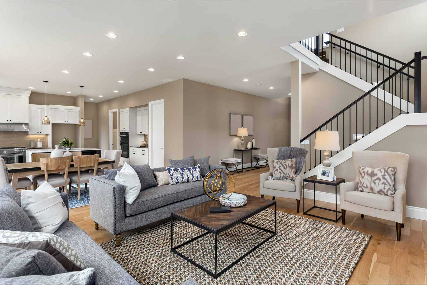 modern living room with taupe walls and recessed lighting