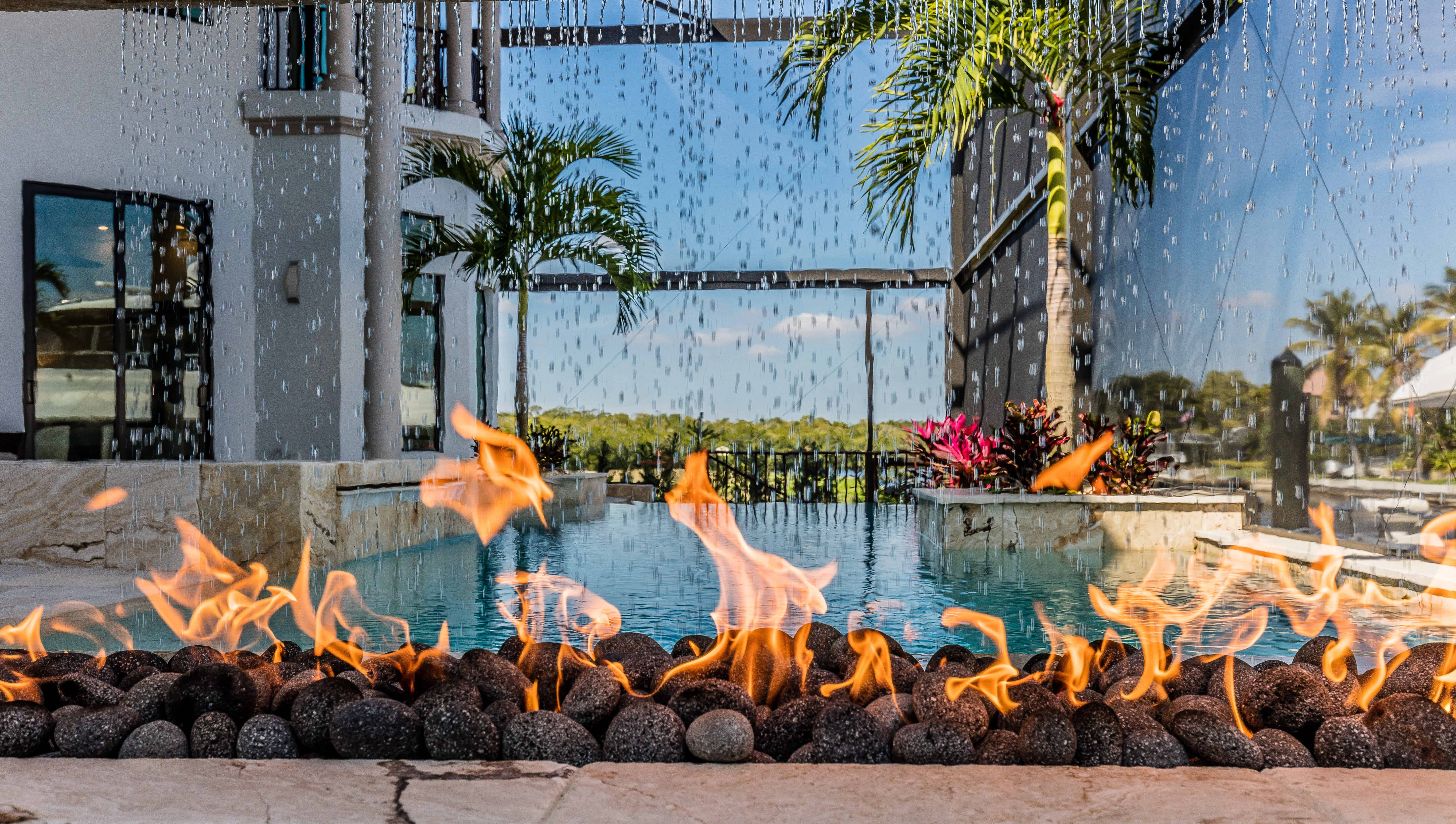 Orlando FL outdoor living room with pool and firepit