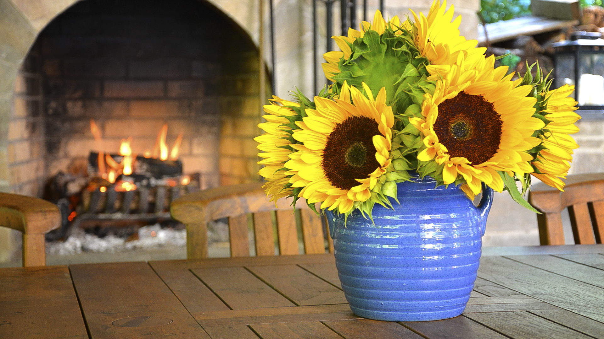 Flowers in front of fireplace