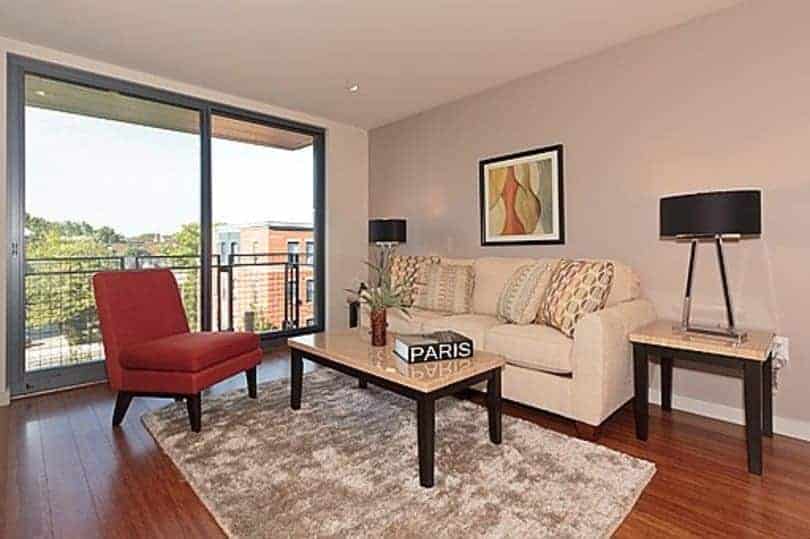 Six 9 One condos Boston: Living room with balcony and view