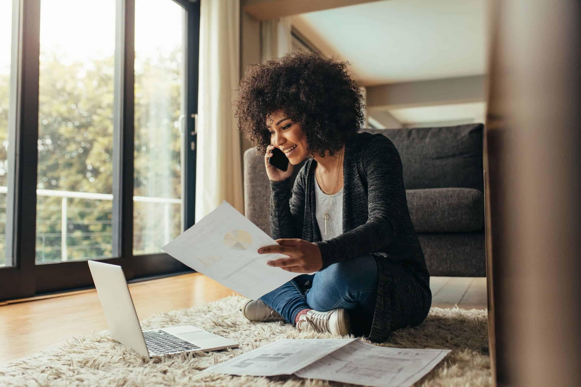 Woman working from her living room