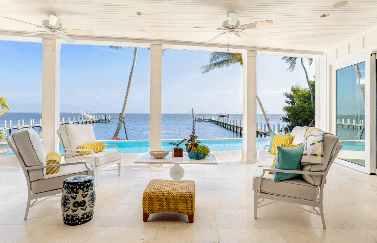 Backyard patio with chairs and pool